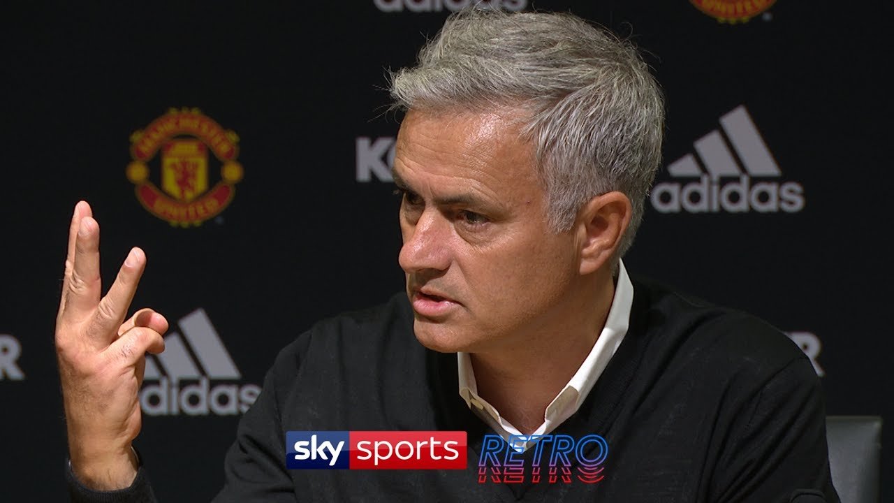 Jose Mourinho holding up three fingers in a press conference