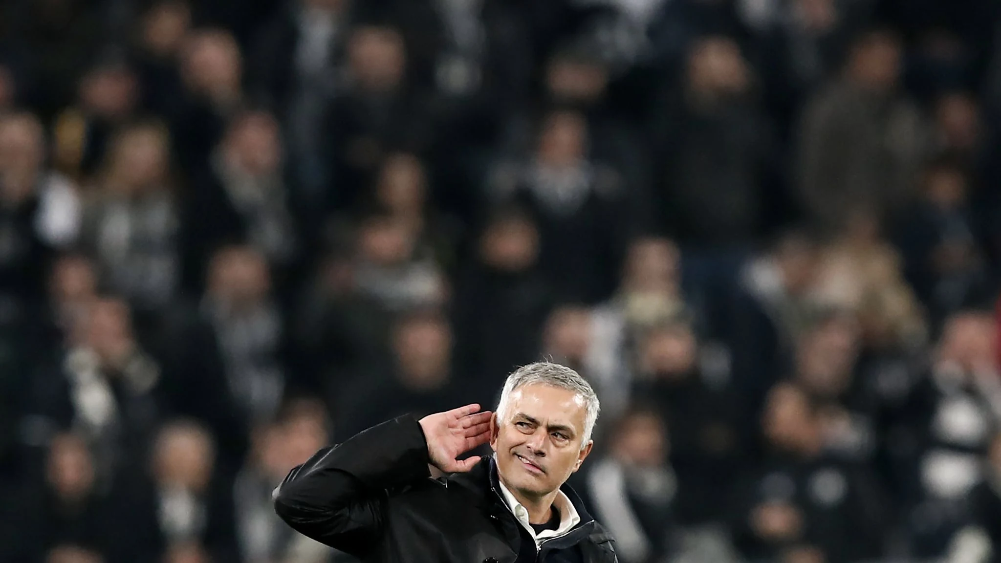 José Mourinho cups his ear towards the Juventus crowd after Manchester United’s win in Turin